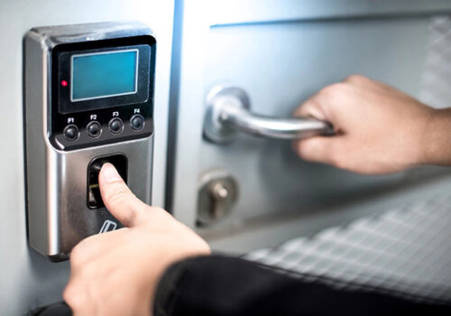 Man opening safe with an access control system in Janesville, WI