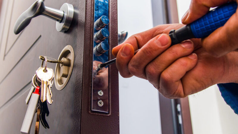 Man working on door for door frame repair in Rockford, IL